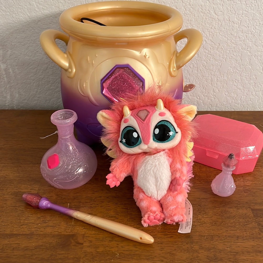 Magic Mixie magical misting cauldron with interactive pink plush toy
